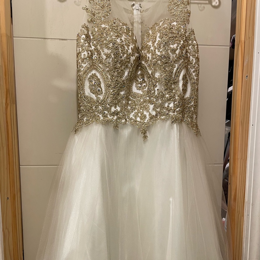 I’m selling this Beautiful white short dress worn once very shiny and bling.